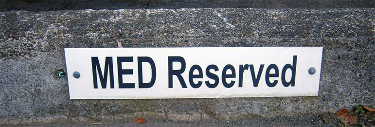 MED Reserved parking sign on curb