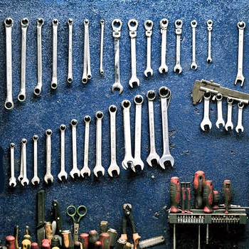 shop tools organized on a wall