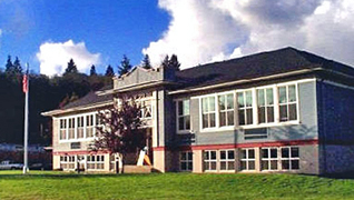 Riverview Center against a blue sky and billowy clouds