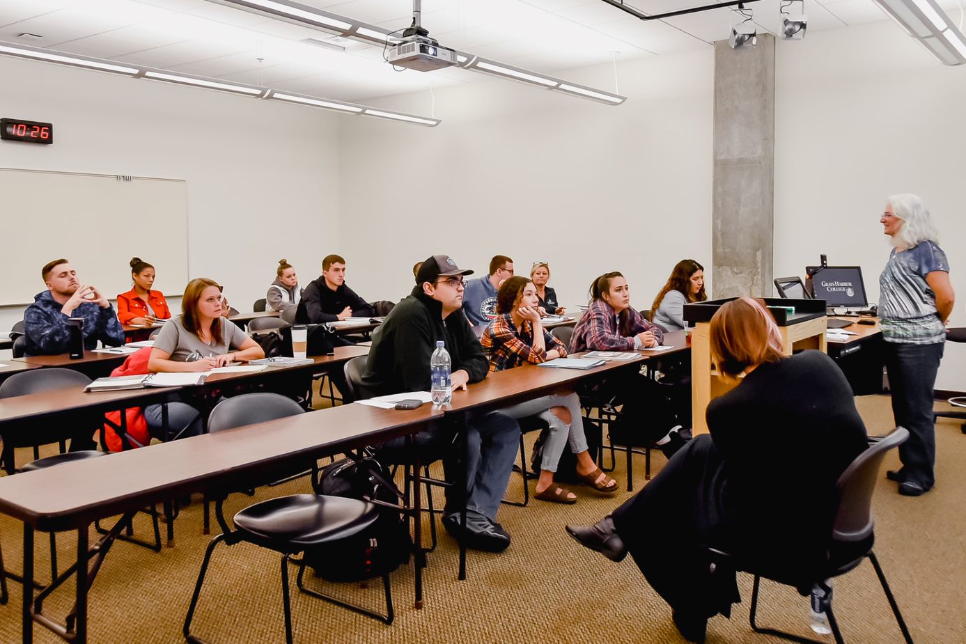 Students in a classroom with an instructor teaching