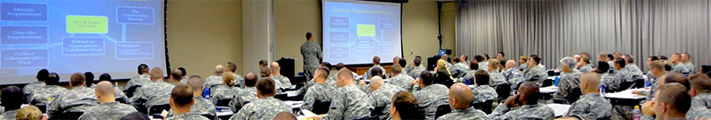 a large classroom full of military personnel