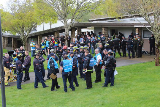 gathering of all response teams and victims outside 300 building after event