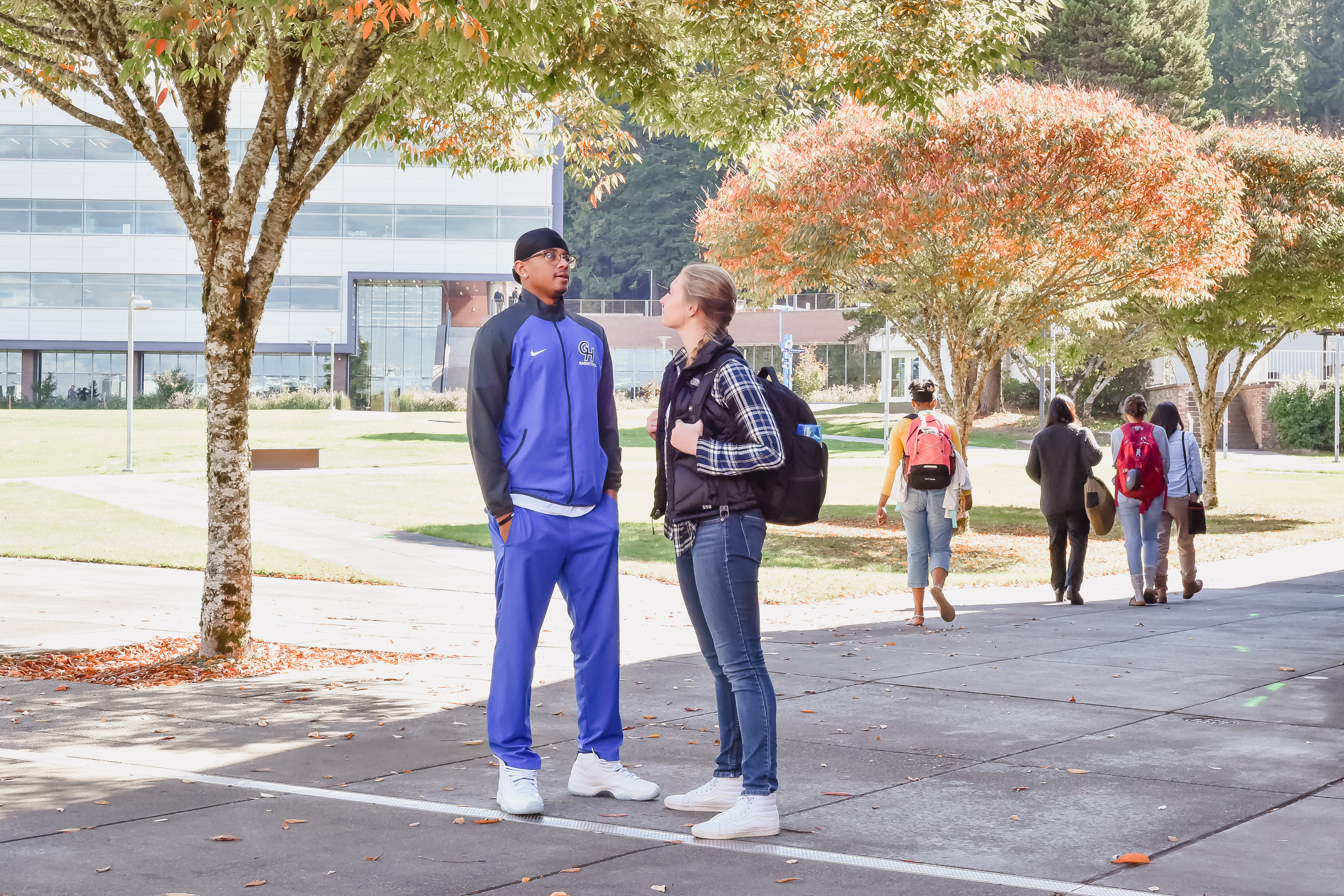 A picture of two students talking to each other