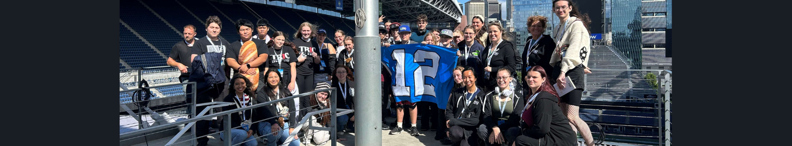 GHC TRIO Upward Bound students raise the 12th Man Flag at Lumen Feild.