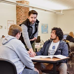 Students receiving assistance from a classroom instructor