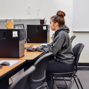 Student taking a placement test on a computer