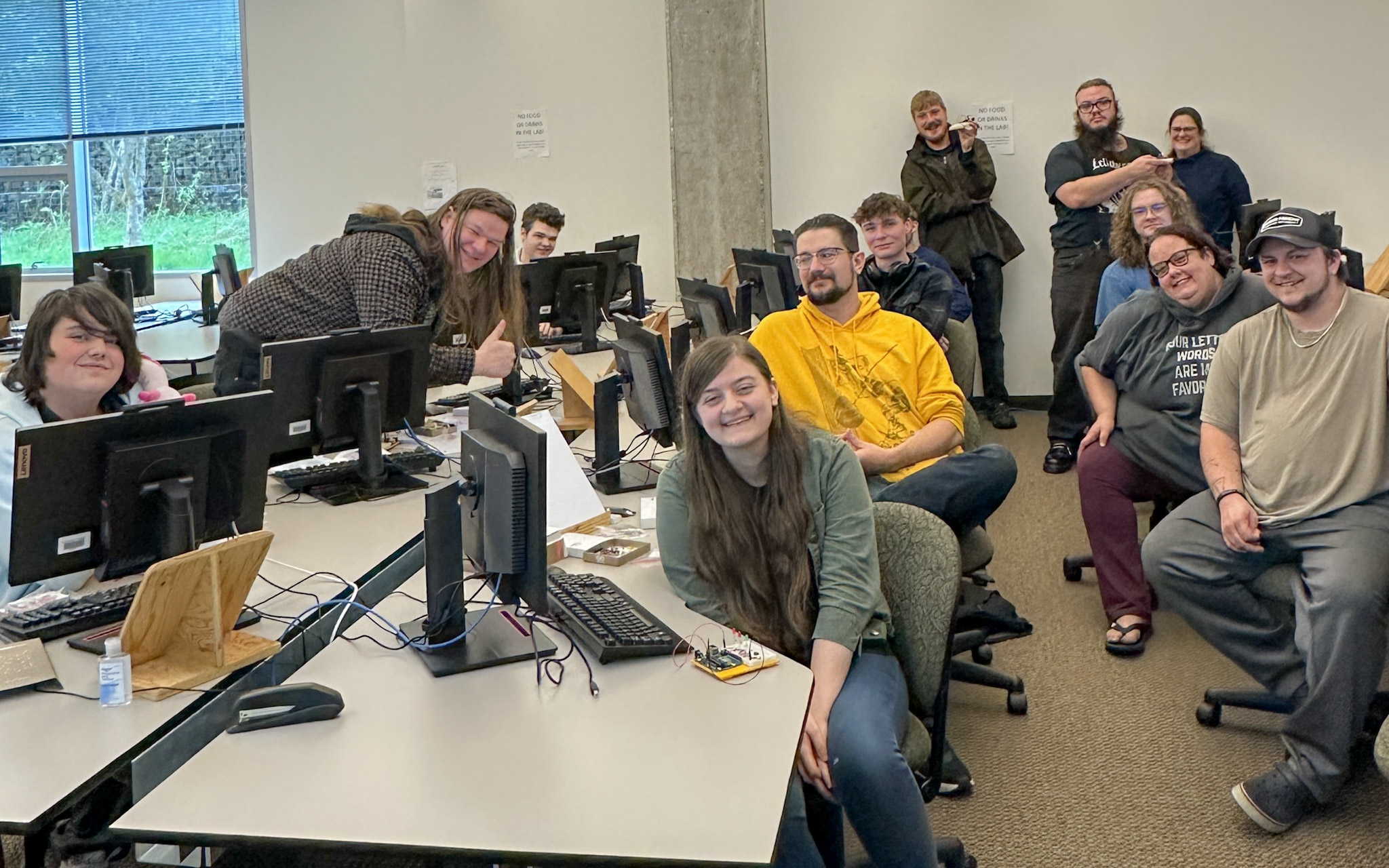 Students in the GHC Computer Science program in the computer lab in front of rows of computers