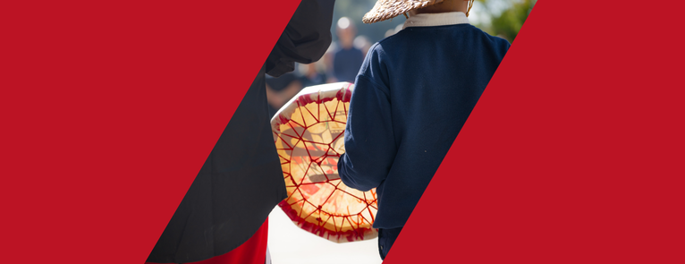 A back view of a a child of the Quinault Nation drumming during a Blessing for tulalW to promote Indigenous Peoples' day.