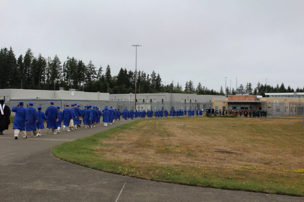 Graduates walking down a path